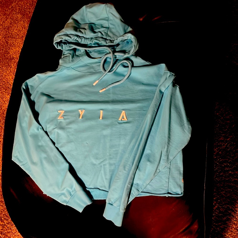 Women’s crop top Large Zyia hoodie, baby blue. Never been worn, without tags.